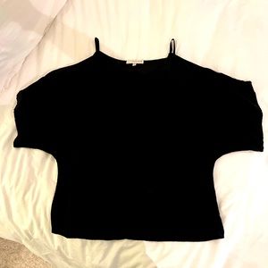 Black blouse with open shoulder cutouts.